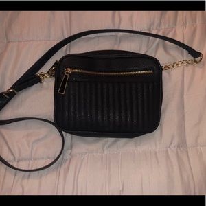 Small black purse with shoulder strap